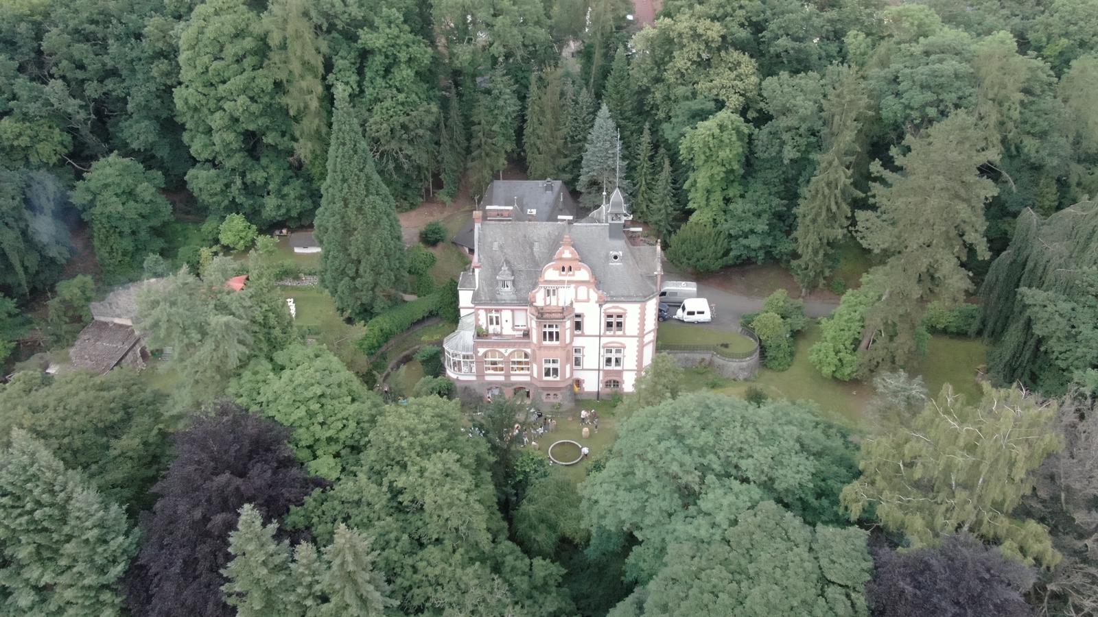 Aerial view of a large private home and garden